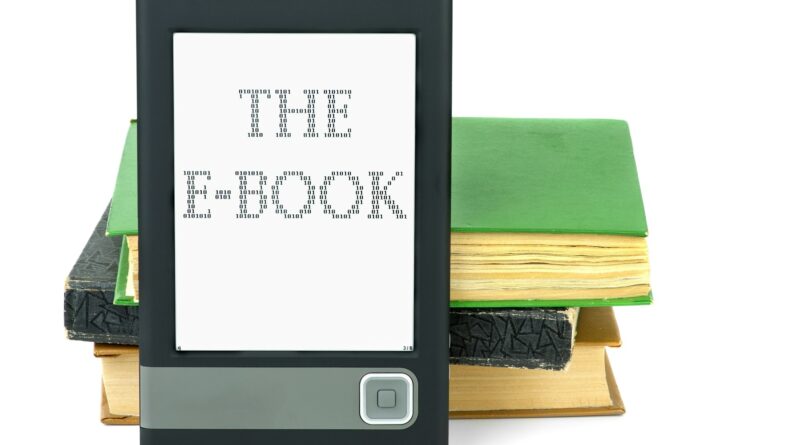 Modern ebook reader and old paper books